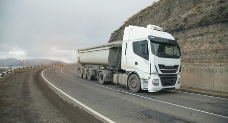 Truck driving at the highways. Transportation. Delivery