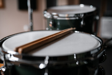 Drum sticks on a snare drum