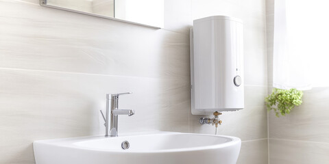 Modern bathroom interior with electric water heating boiler. Alternative individual heater in a cottage