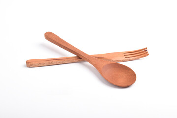 Wooden spoon and fork, crossed as road sign, isolated on white background. Houseware