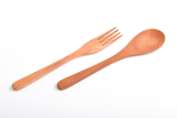 Wooden spoon and fork isolated on white background. A set of kitchen utensils