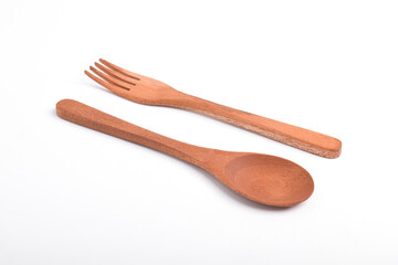Wooden spoon and fork isolated on white background. A set of kitchen utensils