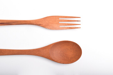Close up of Wooden spoon and fork isolated on white background. A set of kitchen utensils