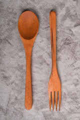 Top view of Wooden spoon and fork on table. A set of kitchen utensils
