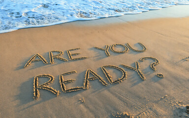 are you ready? text written on beach sand with sea waves. Startup business success, preparation, plan to start, change, action concept.