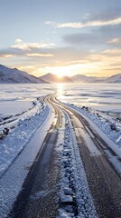 A picturesque road leads to a stunning sunrise over a frozen lake, scenic road, serene scenery