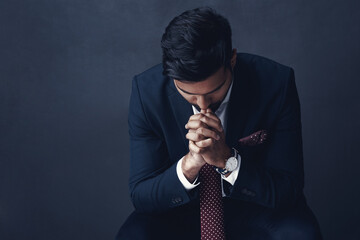 Business man, stress and depression in studio with thinking, decision or sad by dark background....