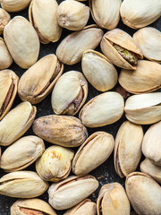 fresh and tasty pistachio nuts on the table, close up