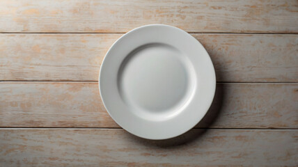 Top view of white empty plate on light wooden table