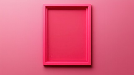 A vibrant pink picture frame set against a matching pink background, creating a bold and minimalist aesthetic.