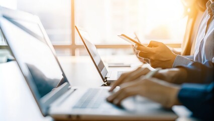 Team using technology tools to make informed decisions, with a soft-focus background.	
