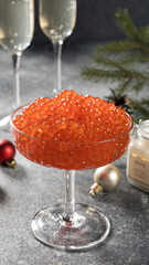 Festive red caviar in a champagne glass, capturing the New Year’s spirit.