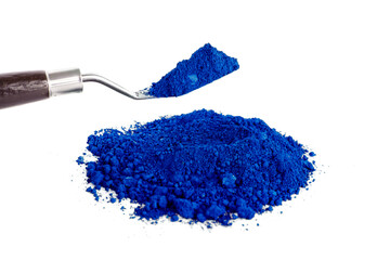 Bright Blue Pigment on a Palette With a Tool for Mixing and Application