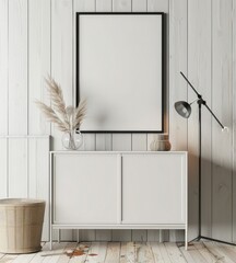 Minimalist interior design with a white cabinet. a lamp. a clock. a round rug. a vase with dried flowers. and a black framed empty poster on a white wall