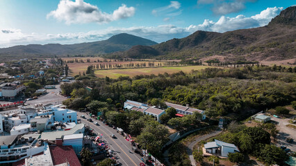 Aerial view of Kenting National Park showcasing lush greenery and mountains under a vibrant sky