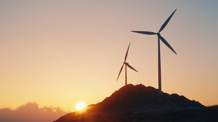 environmental consideration conservation nature concept. Silhouetted wind turbines at sunset on a hilltop.