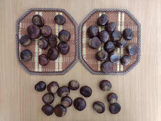 Shiny brown chestnuts on the table