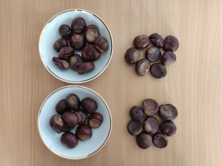 Shiny brown chestnuts on the table