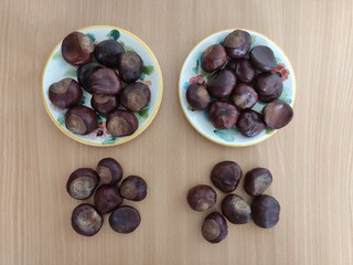 Shiny brown chestnuts on the table