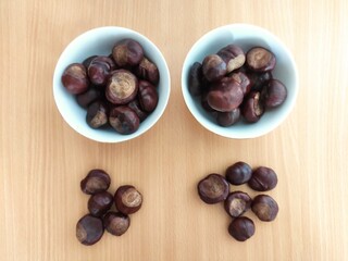 Shiny brown chestnuts on the table