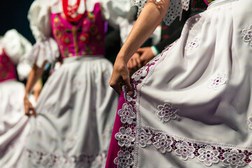 Detail of woman's hand  with traditional dress during dance