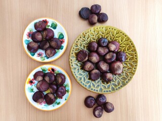 Shiny brown chestnuts on the table