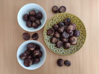 Shiny brown chestnuts on the table