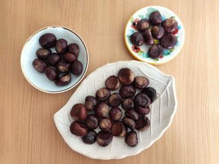 Shiny brown chestnuts on the table