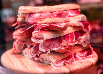 Bocadillos with Iberian Ham (jamón ibérico de bellota) in a Delicatessen shop.
