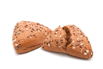 Fitness bread. Broken and the whole loaf of organic bran bread with seeds and sesame isolated on white background. Assortment of bakery products.
