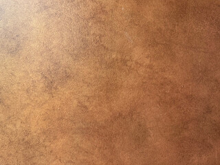 Copper metallic textured paint washed on a wall or panel, seamless background texture, random...