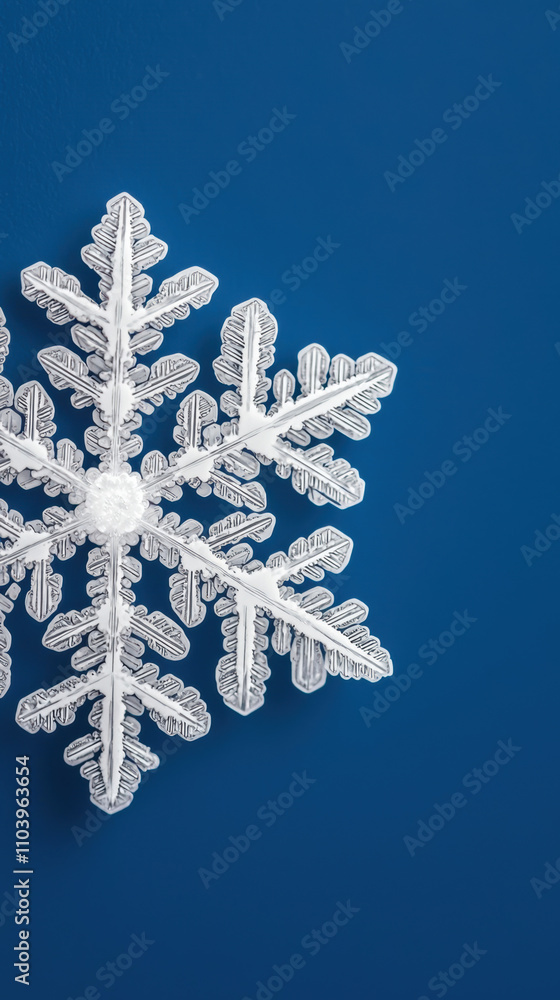 Poster a delicate snowflake design against a deep blue background, showcasing intricate patterns and textur