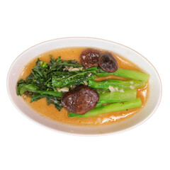 A plate of vibrant greens, tender vegetables, and savory mushrooms in a flavorful sauce.