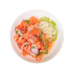 A vibrant dish featuring diced salmon with onions, garnished with lettuce and shredded cabbage, served in a round plate.