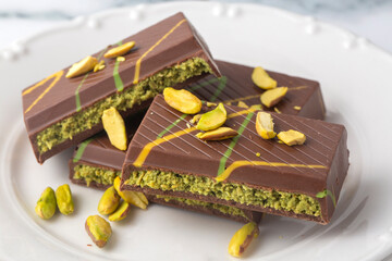 New trend chocolate; Chocolate with pistachio paste and kadayif; Dubai chocolate.
