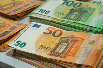 Euro banknote cash money. Lot of banknotes of European union currency close up. Financial investment, savings, income earnings concept.