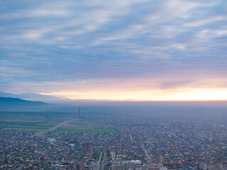 City landscape. Evening view from a drone of the city during sunset. Park, trees, roads, streets,...
