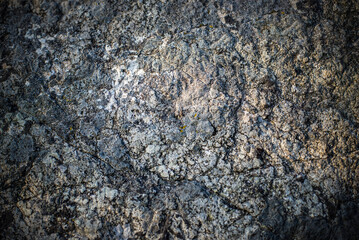 Stone wall texture is old and naturally aged.