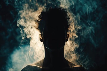 Fototapeta premium A person standing in front of a dark background, perfect for representing isolation or mystery