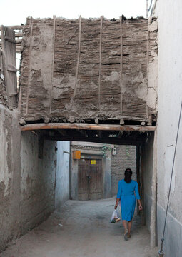 Uyghur Woman Walking In The Street, Yarkand, Xinjiang Uyghur Autonomous Region, China