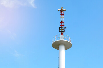 Flood warning tower on the background of a bright daytime sky. soft and selective focus.