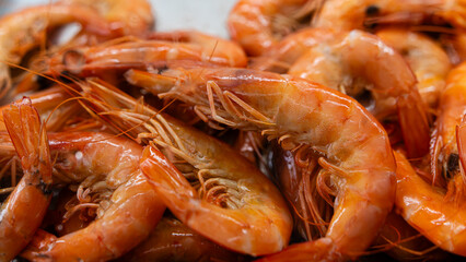 Freshly cooked shrimp ready for serving at a coastal seafood market in the afternoon