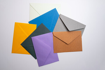 Paper envelopes on a light background. New mail, write a message. Send and receive mail. Postal...