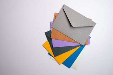 Paper envelopes on a light background. New mail, write a message. Send and receive mail. Postal delivery service. Empty envelope, empty space. Communication with people, paperwork. Envelope close-up 