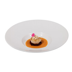 A beautifully plated dish featuring a seafood item garnished with a flower, resting on a rich sauce.