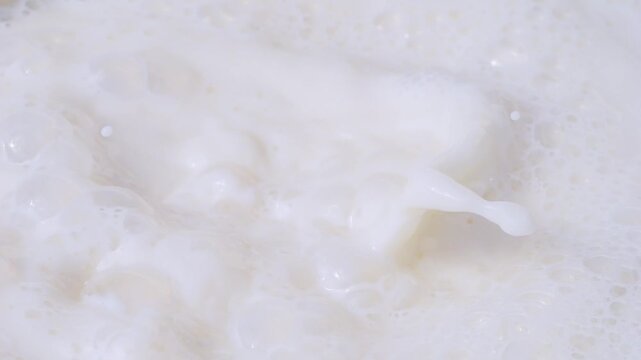 Radishes splashing into milk in slow motion 300fps