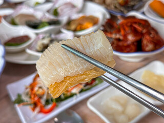 Korean food. Skate sashimi and white kimchi
