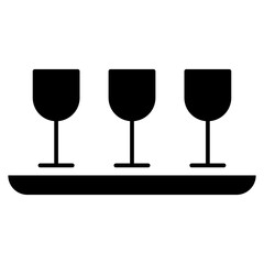 Three glasses filled with liquid on a round tray, showcasing elegance and balance.
