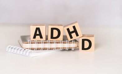 ADHD Abbreviation on ADHD cubes on a light background. Close ADHD - Attention Deficit Hyperactivity...