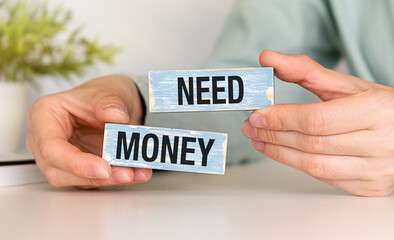 Need Money Question on wooden blocks, Business Concept.